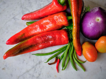 Close-up of red chili peppers on table