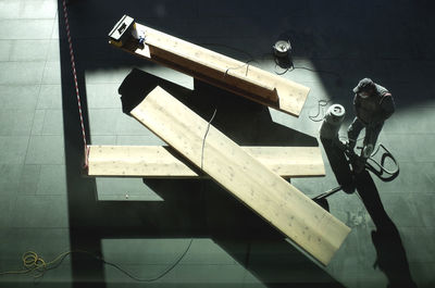 High angle view of carpenter working in workshop