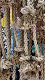 Close-up of ropes tied hanging on rope