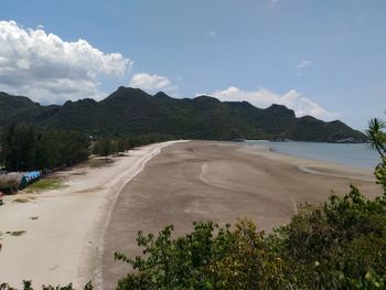 Scenic view of mountains against cloudy sky