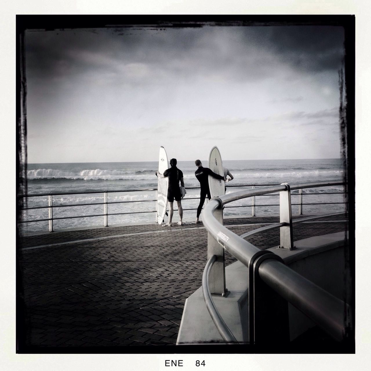 sea, horizon over water, sky, transfer print, men, rear view, water, full length, lifestyles, person, cloud - sky, leisure activity, auto post production filter, cloud, walking, railing, standing