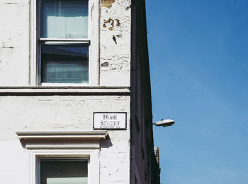 Low angle view of building against blue sky