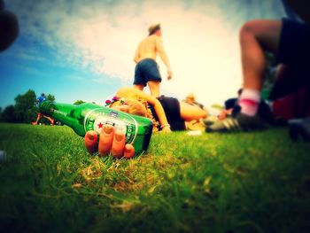 People walking on grassy field