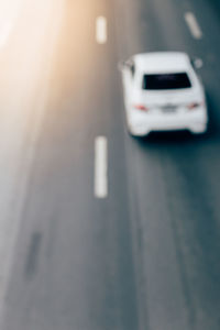 Close-up of car on road