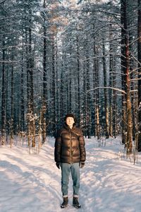 Full length portrait of young woman in winter