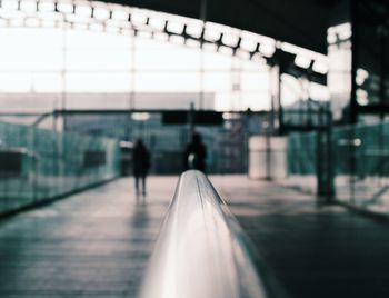 Silhouette people on railroad station platform