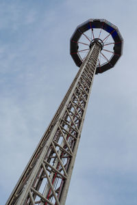 Low angle view of ferris wheel against sky