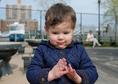 Beautiful boy at a table on the playground