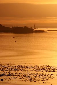 Scenic view of sea against sky during sunrise