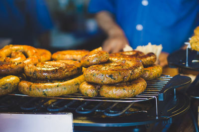 Close-up of meat on barbecue grill