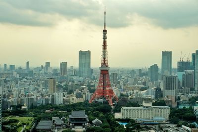 Tokyo tower against cloud sky