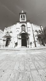 Low angle view of bell tower against sky