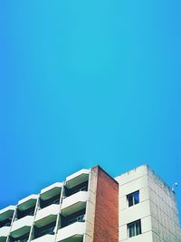 Low angle view of building against blue sky