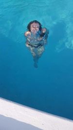 High angle view of man swimming in pool