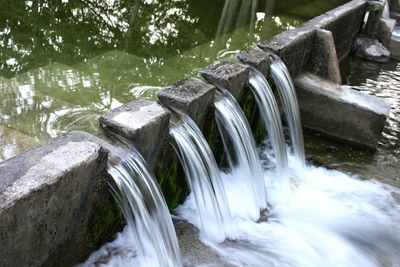 High angle view of water falling over wall