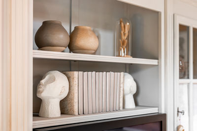 Close-up of containers on shelves