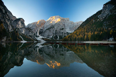 Scenic view of lake and mountains against sky