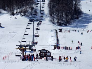 Group of people on snow covered landscape