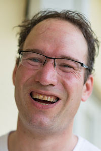 Close-up portrait of smiling young man