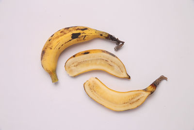 High angle view of bananas on white background