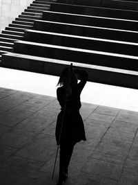 Silhouette woman standing on street
