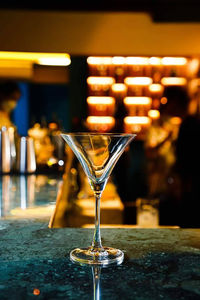 Close-up of wineglasses on table