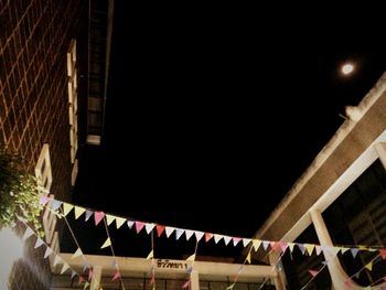 Low angle view of illuminated building at night