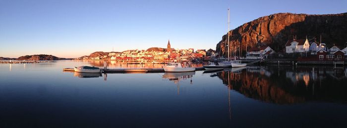 Boats moored at harbor