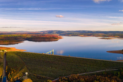 Drone aerial panoramic view of sabugal dam lake reservoir with perfect reflection, in portugal