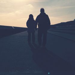 Silhouette of woman at sunset