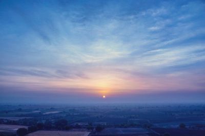 Scenic view of landscape at sunset