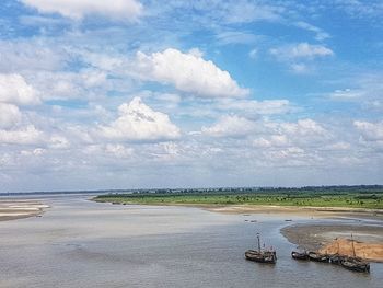 Scenic view of sea against cloudy sky