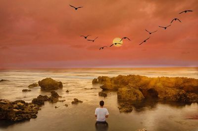 Scenic view of sea against dramatic sky