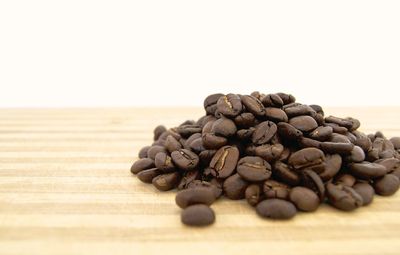 Close-up of coffee beans on table