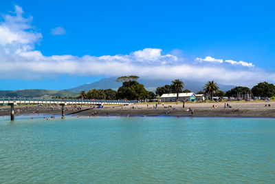 Scenic view of beach against blue sky