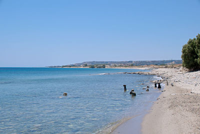 Scenic view of sea against clear blue sky