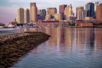 Scenic view of sea and buildings against sky