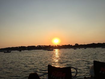 Scenic view of sea against orange sky
