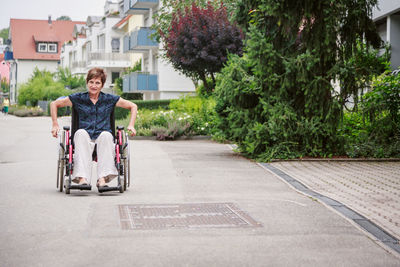 Full length of woman sitting in park