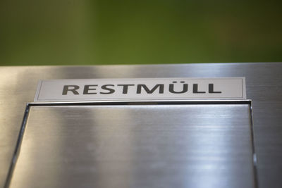 High angle view of information sign on table