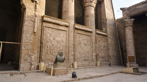 Temple of horus edfu columns and structure around corridor and entrance with hieroglyphic details 