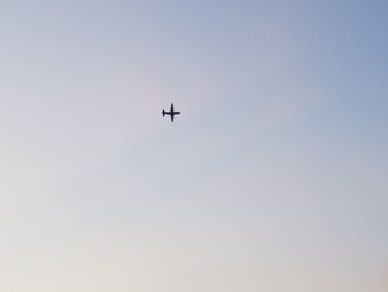 Low angle view of airplane against clear sky
