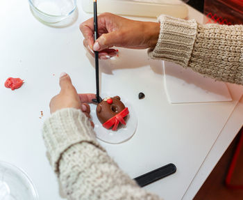 Cropped hand of person preparing food