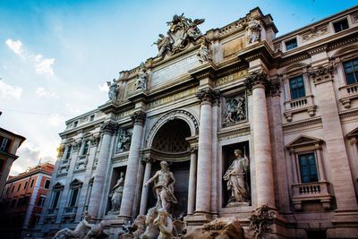 Trevi fountain against sky in city