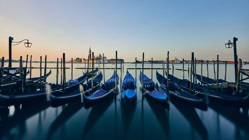 Boats moored in canal