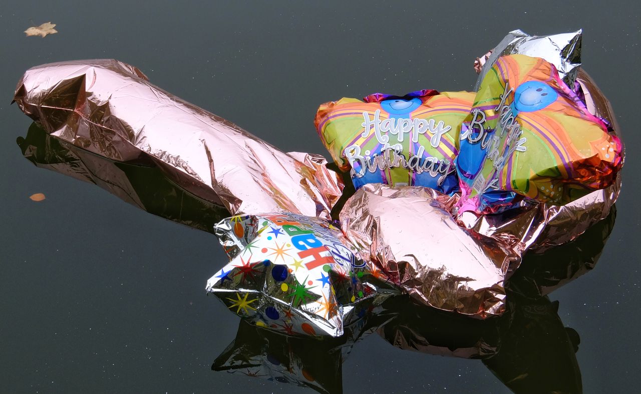 reflection, water, close-up, outdoors, multi colored, no people, sunlight, nature, day