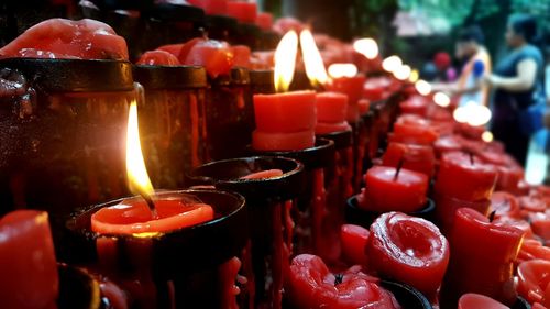 Close-up of tea light candles in temple