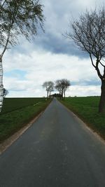 Road amidst landscape against sky