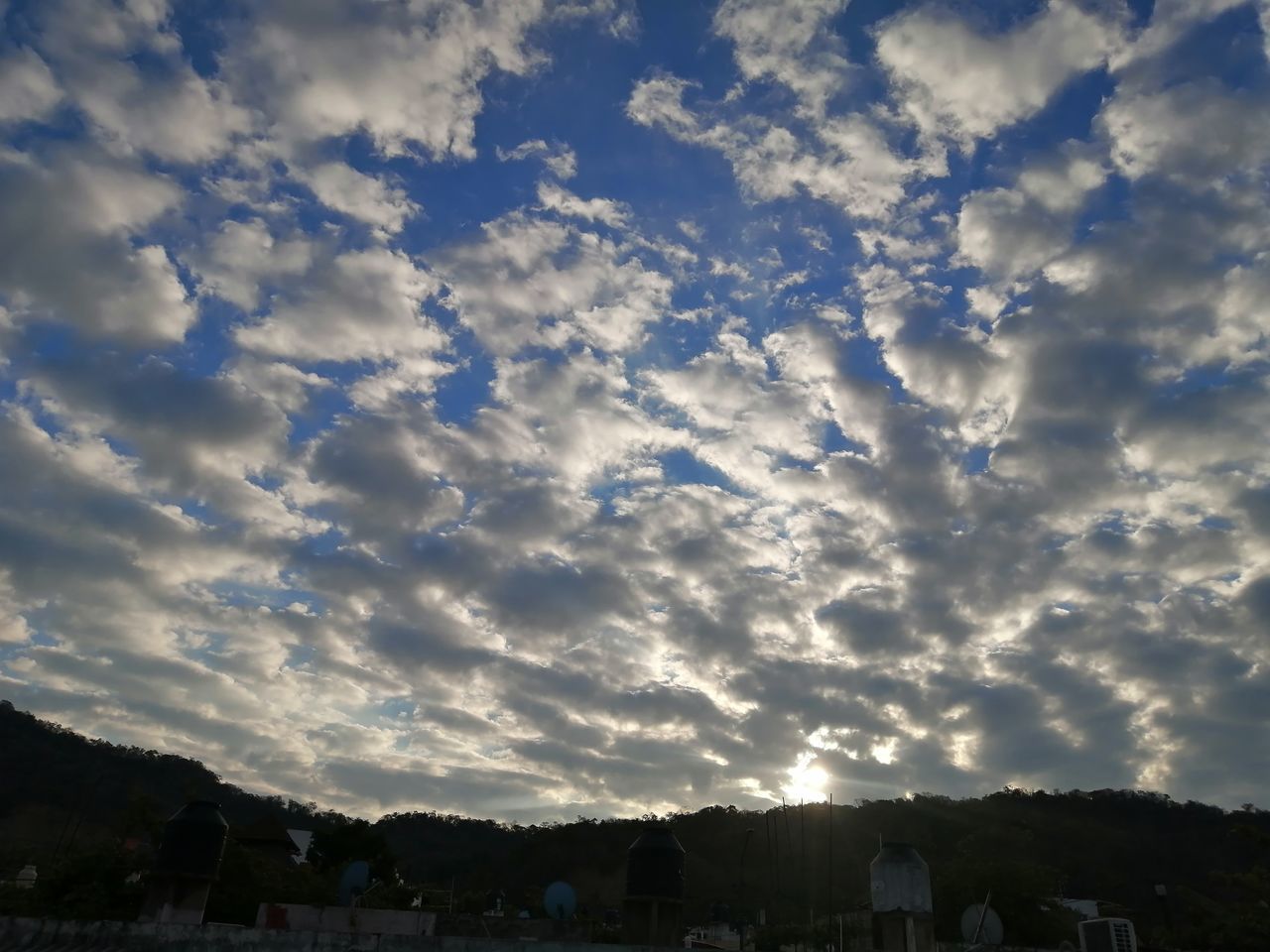 HOUSES AGAINST SKY