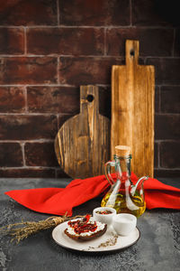 Close-up of drink on table against wall